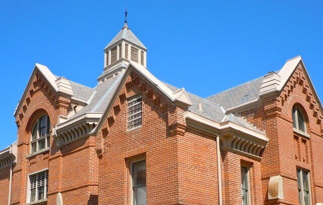 Victorian brick exterior of the Historic Squirrel Cage Jail in Council Bluffs, Iowa