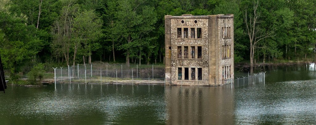 Concrete tower ruins of Monte Ne standing at the edge of Beaver Lake
